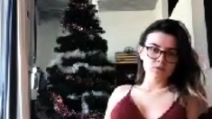 Brunette with glasses masturbates hairy pussy