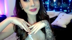Busty curly brunette with big boobs fucks on couch
