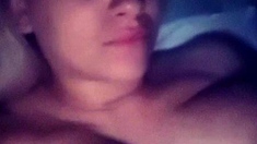 A super sexy brunette massages her big boobs